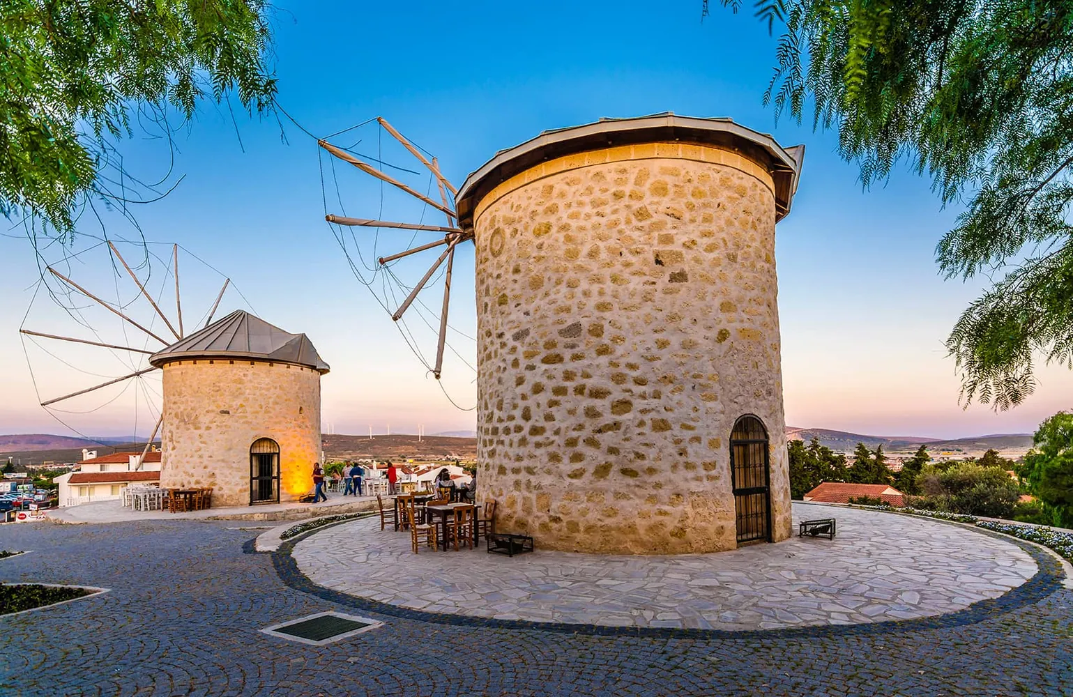 Stone windmills above the cobbled streets of Alaçatı on the Çeşme peninsula