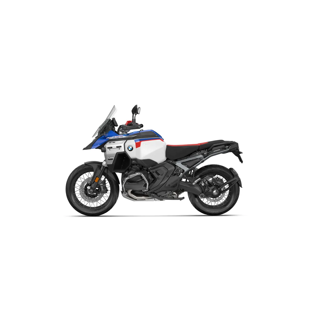 BMW R 1300 GS Adventure side profile in Rallye blue, white and red, showing the 30-litre tank and cross-spoke wheels