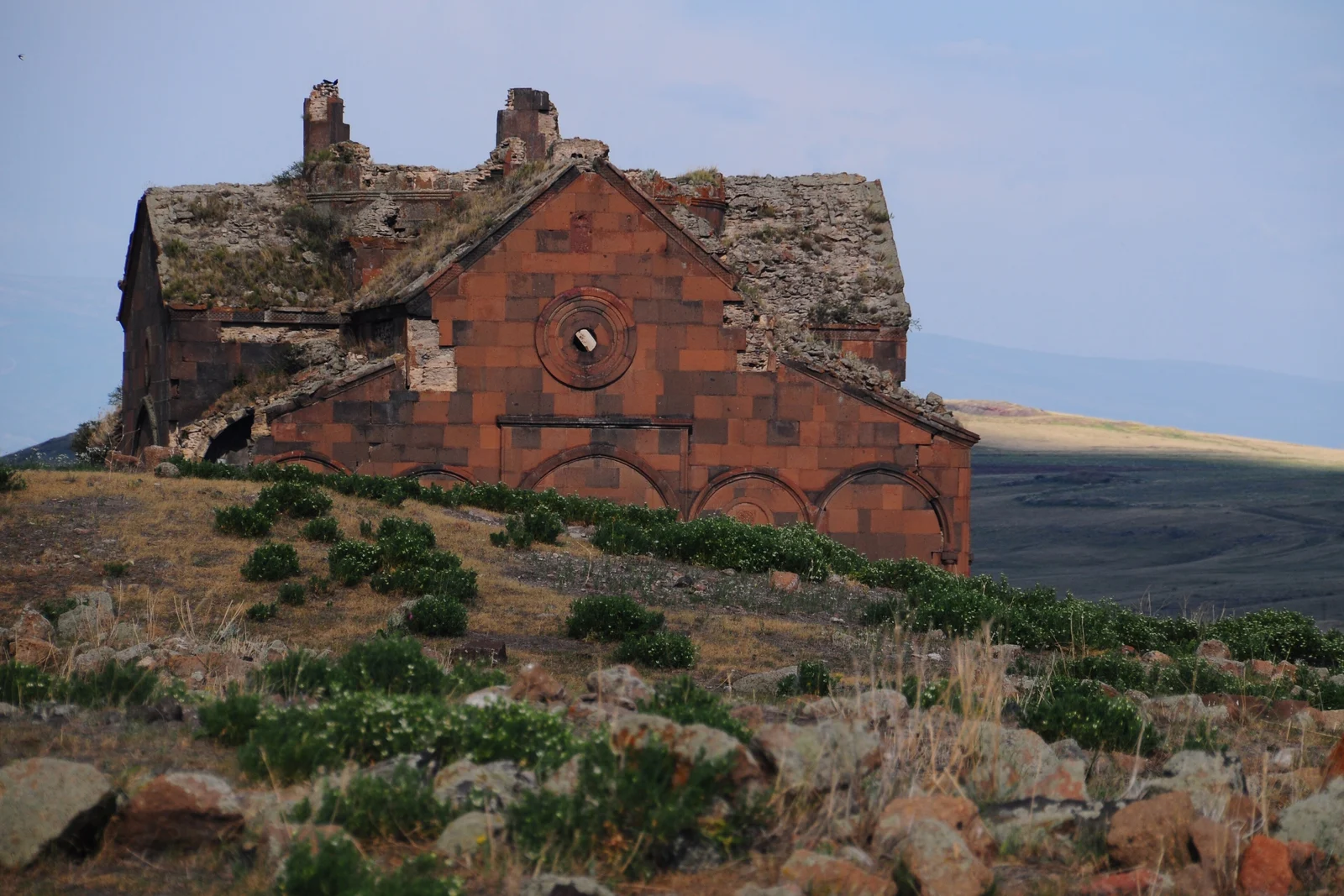 The ruined red-stone cathedral of Ani on the grassland near Kars