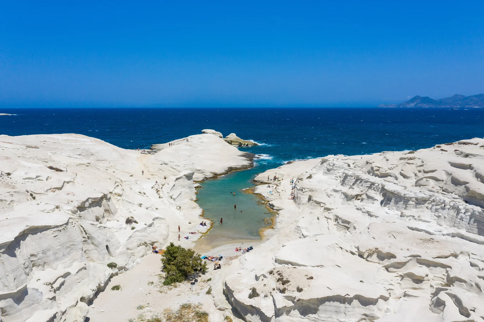 The white volcanic rock formations and narrow inlet of Sarakiniko on Milos