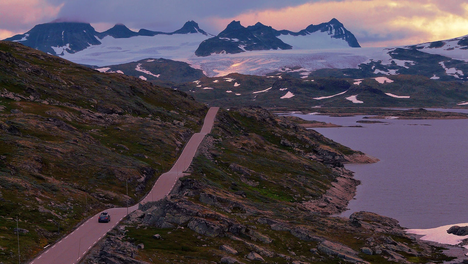 The Sognefjellet mountain pass road through snow patches in Jotunheimen