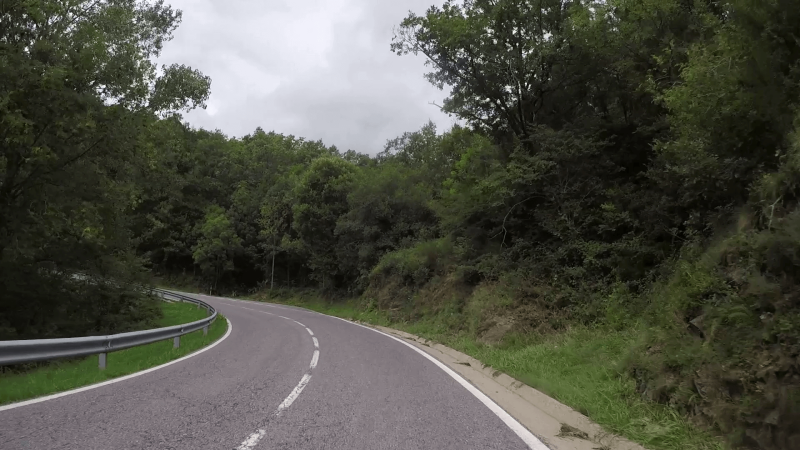 The N-260 road curving through a gorge in the high Spanish Pyrenees