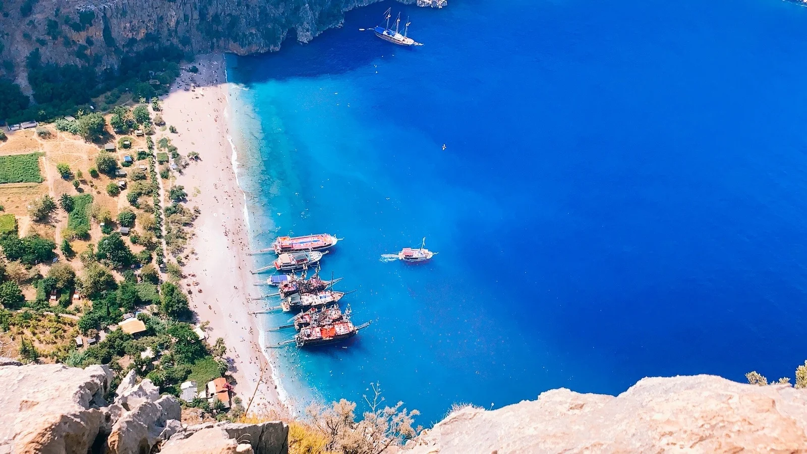 Butterfly Valley beach far below, seen from the cliffs above