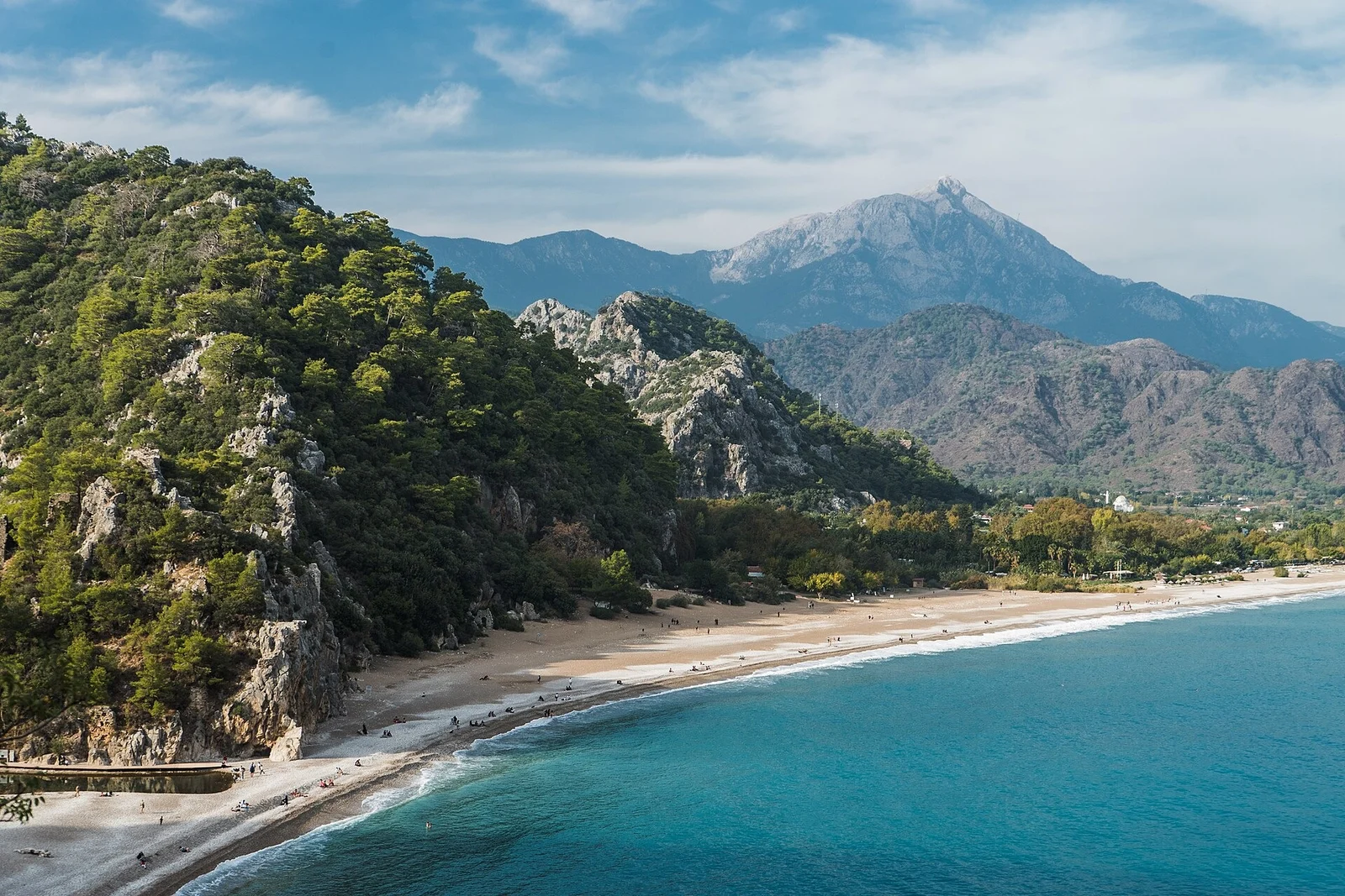 The long Çıralı beach with forested hills and Tahtalı Dağı behind