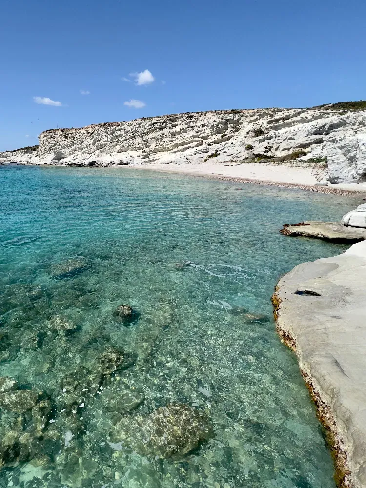 White limestone rock arch and clear water at Delikli Koy, Çeşme